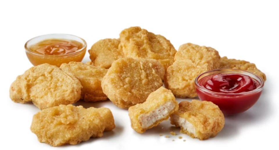 Chicken McNuggets with honey mustard and ketchup.